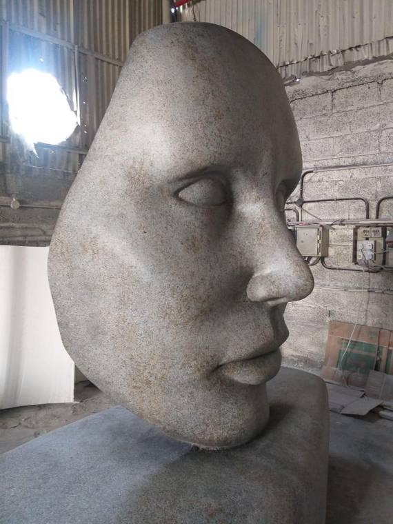 Face sculpture, stone finish